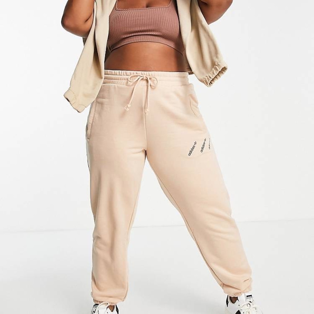 Adidas Originals 'Logomania' triple logo joggers in blush